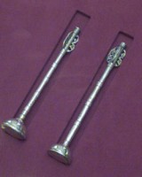 Two lesser maces, 30cm long silver rods